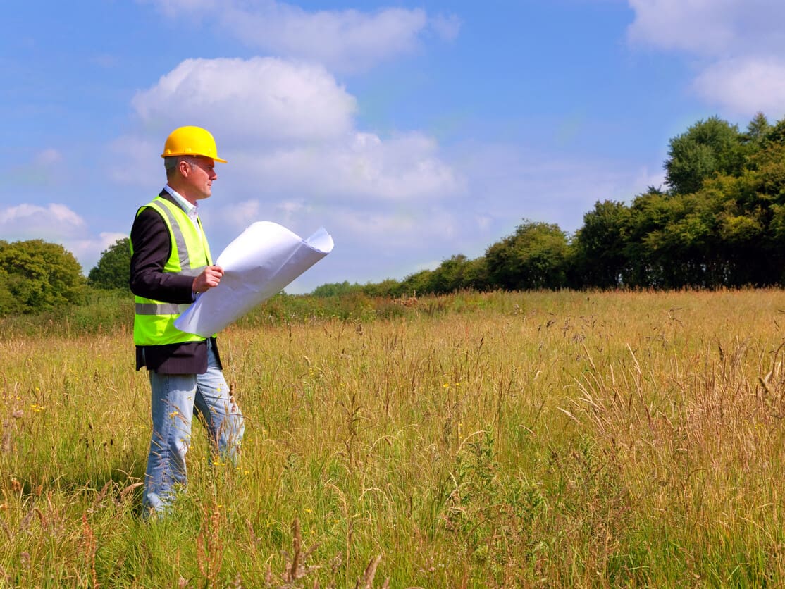 Architect surveying a new building plot