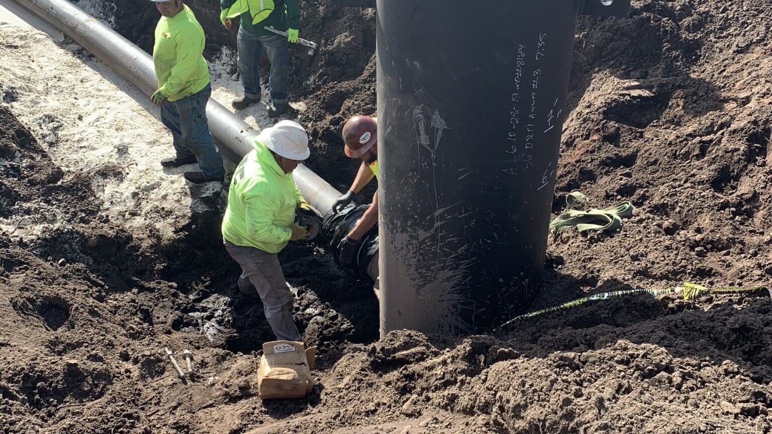 Men working on pipe installation